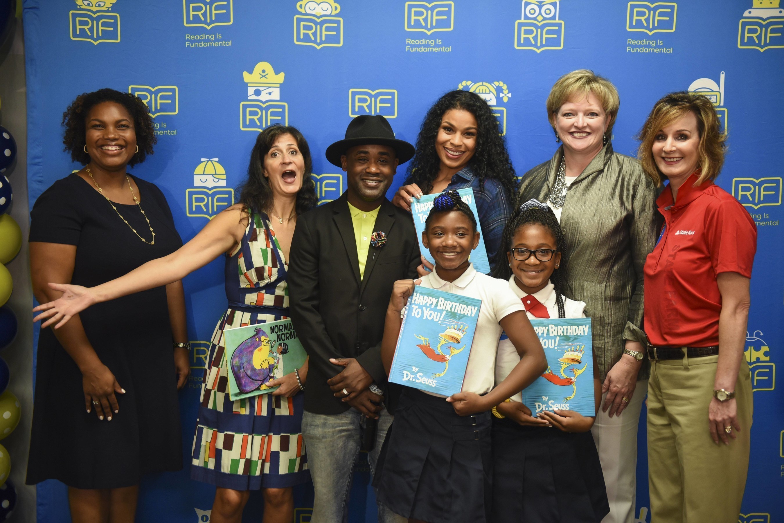 From left, Principal TaMikka Sykes, children's author Tara Lazar, actor/musician Tray Chaney, singer/actress Jordin Sparks, RIF President and CEO Alicia Levi, State Farm Senior Vice President and RIF Board Member Christy Moberly along with two students from Amidon-Bowen Elementary School celebrate Reading Is Fundamental's 50th Anniversary on Wednesday, Sept. 14, 2016, in Washington. (Kevin Wolf/AP Images for Reading Is Fundamental)