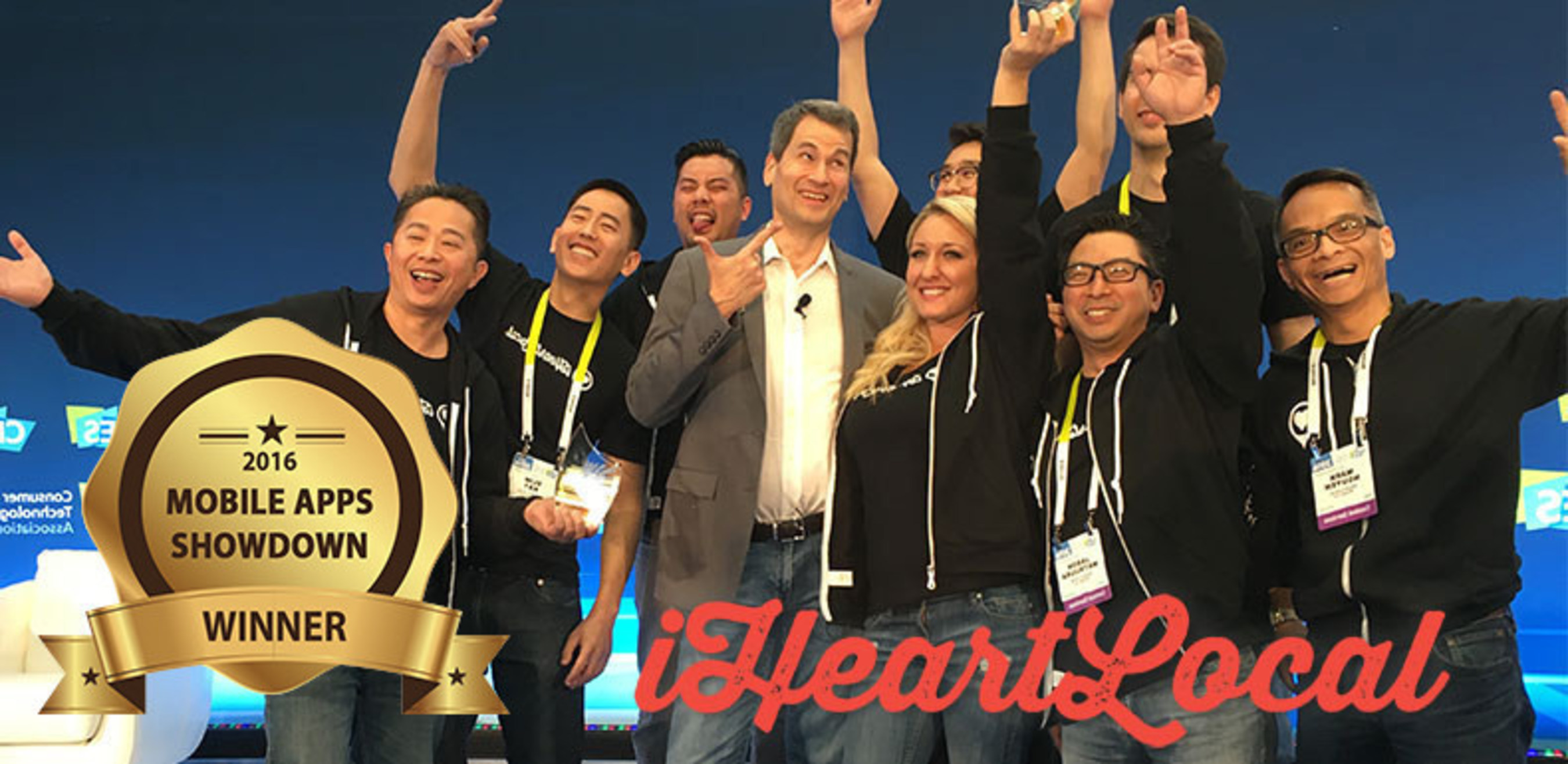 Representatives with iHeartLocal pictured with Yahoo! Tech founder and event emcee David Pogue, celebrate after being named the Mobile Apps Showdown live event and online winner at CES 2016.