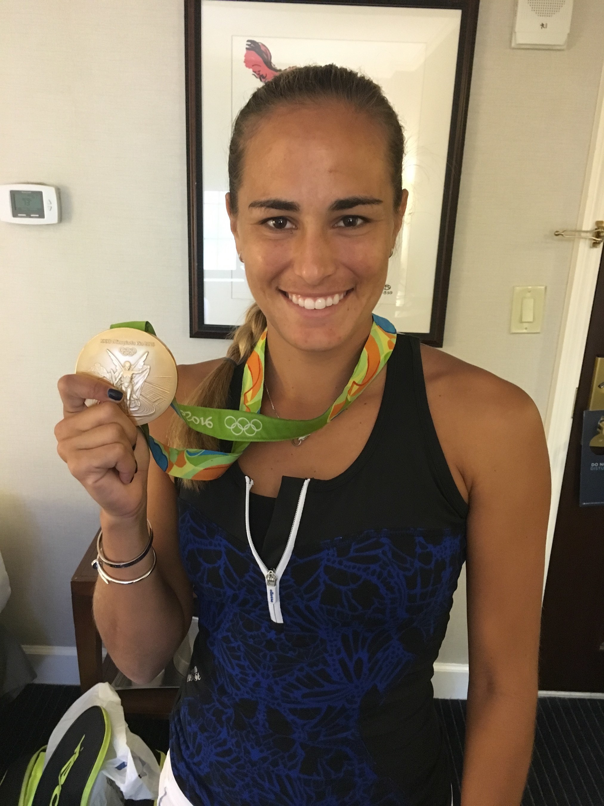 Monica Puig Celebrates her Olympic Gold Medal and urges travelers to visit her homeland. (Photo Credit: Puerto Rico Tourism Company)