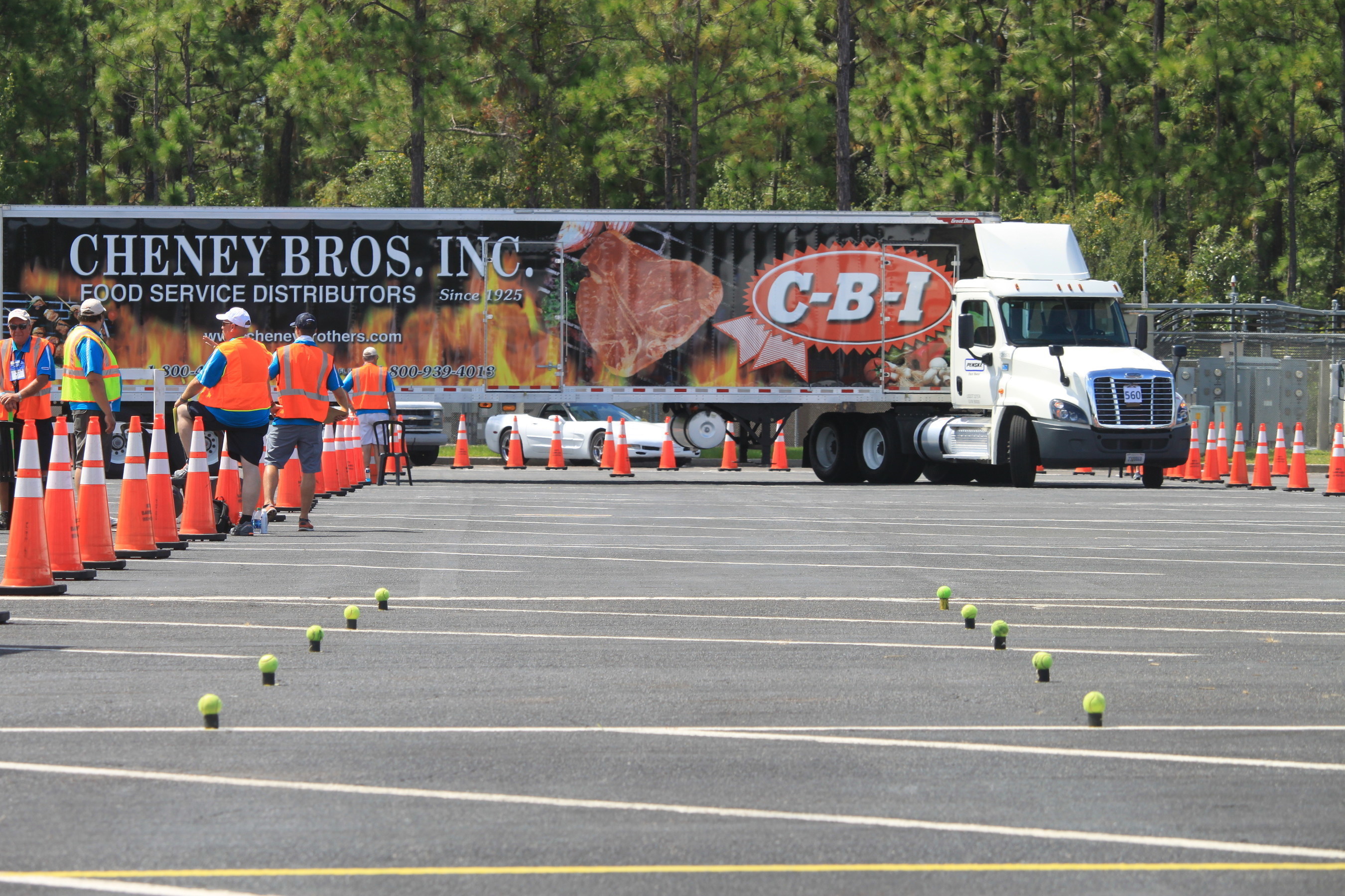 In the U.S., foodservice distributors deliver about 25 million cases of food and other products each day to restaurants and other professional kitchens. During the IFDA Truck Driving Championship (above), a driver in the 48-foot tractor-trailer category takes on the "right turn" challenge where a rear axle tire had to be within 18 inches of the cone to score.