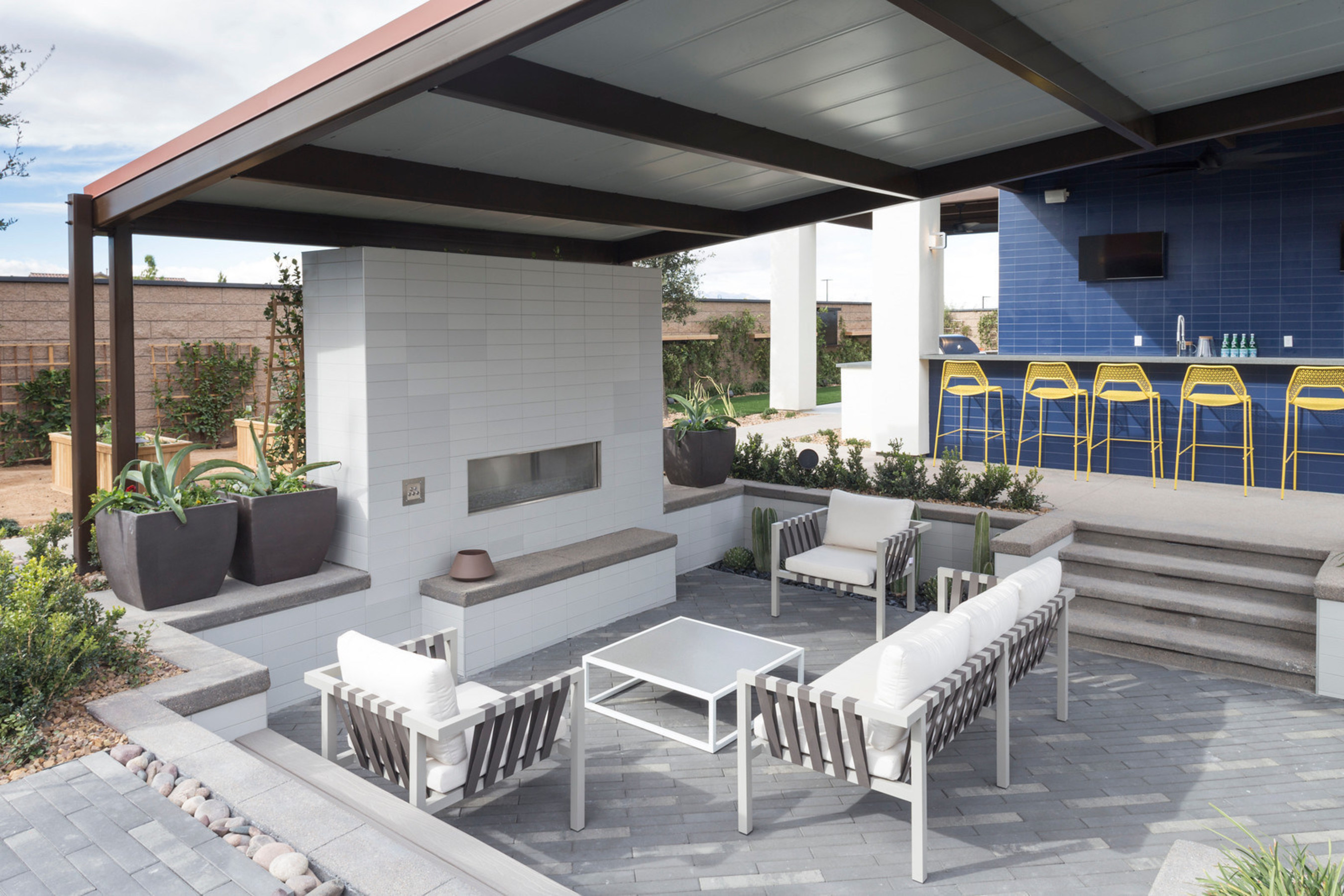 An outdoor living space with fireplace.