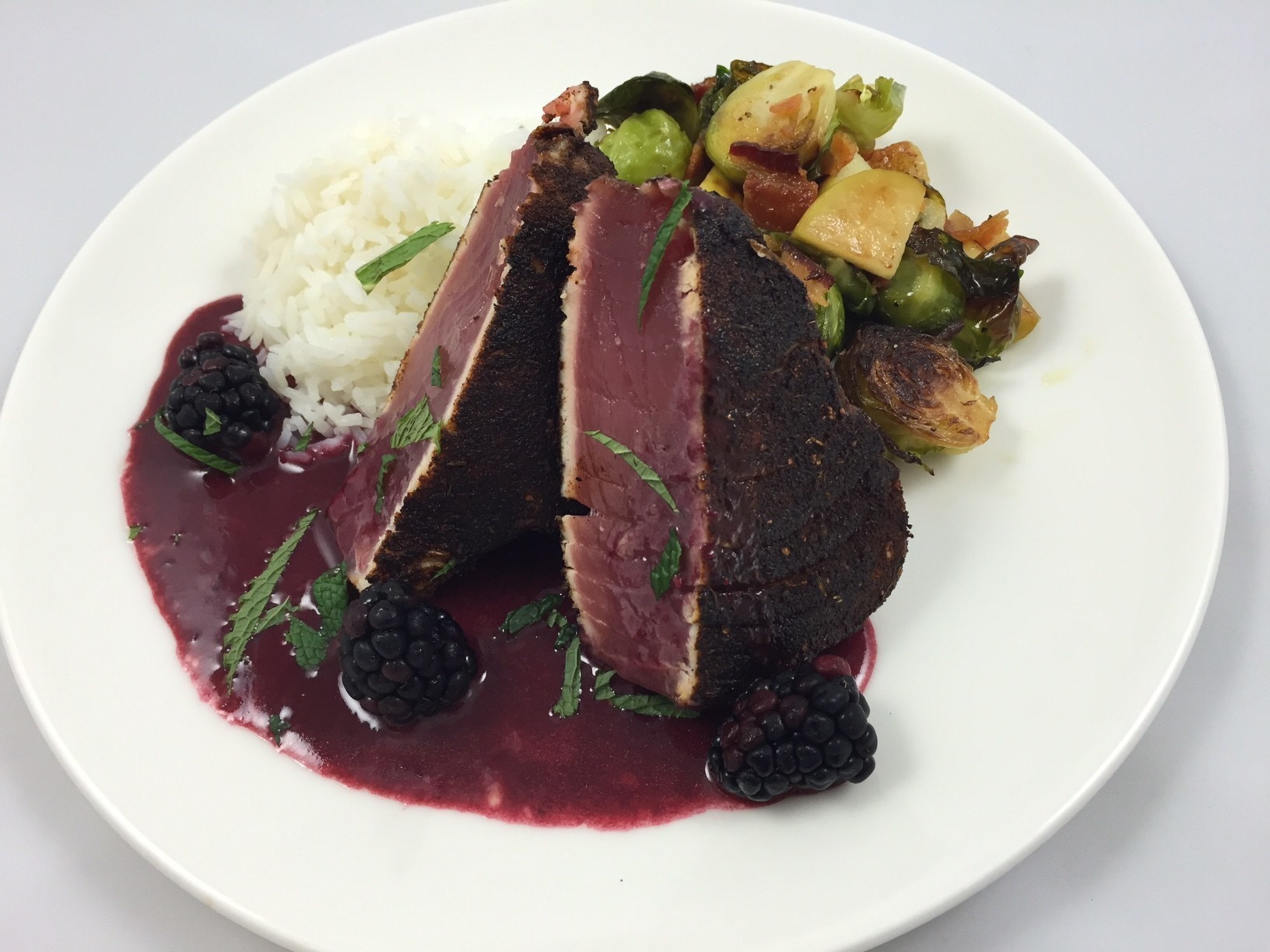 Legal Sea Foods is serving up two d-electable presidential dishes leading up to Election Day.  Guests at all restaurants can choose between the "Secretary of Steak" (pictured here) or the "Trump Tower."  The Clinton-inspired dish is a liberal helping of blackened tuna steak with jasmine rice, bacon-braised Brussels sprouts and blackberry beurre rouge.