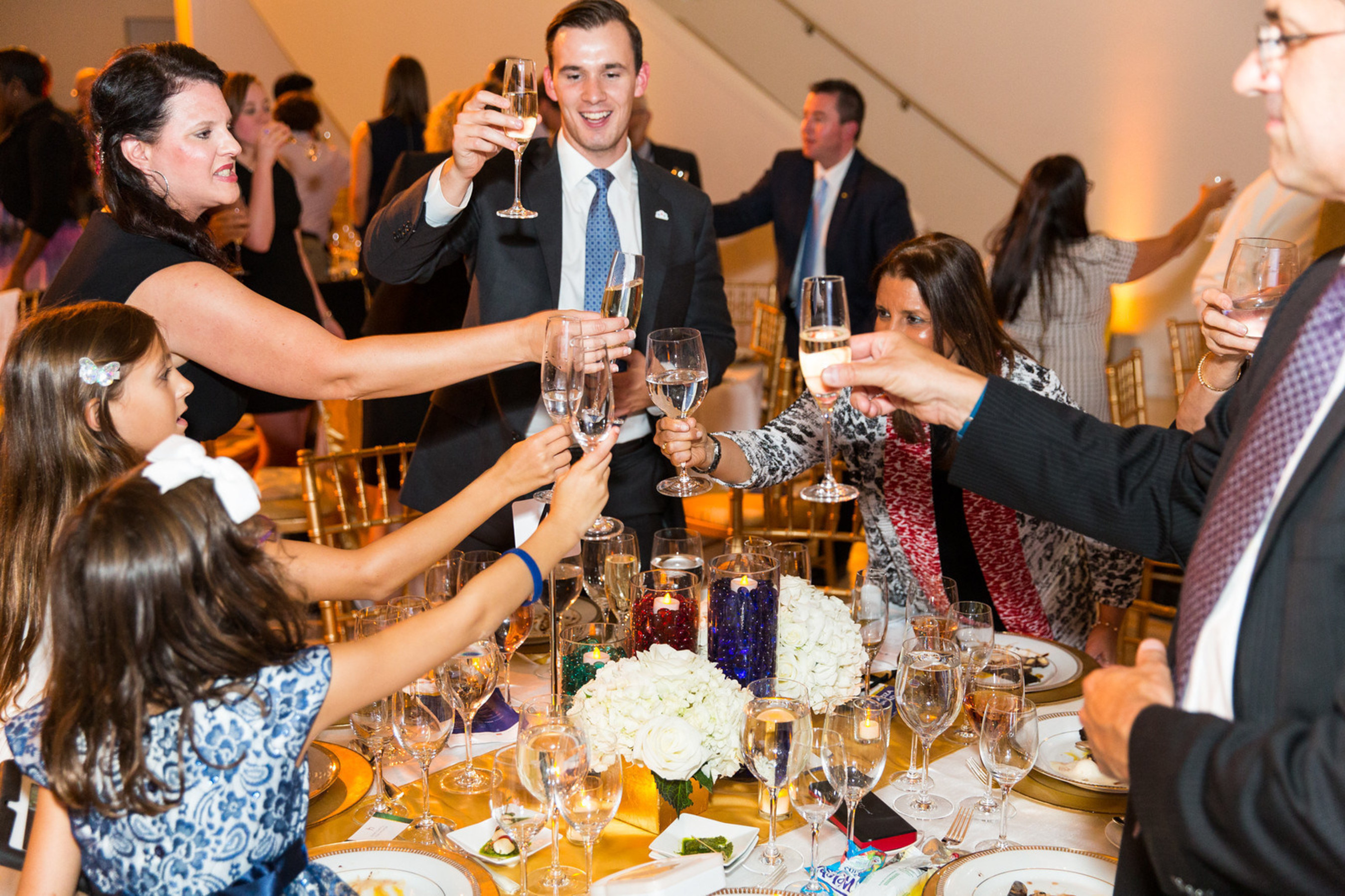 Gala Attendees Participate in the Traditional Champagne (and water) Toast