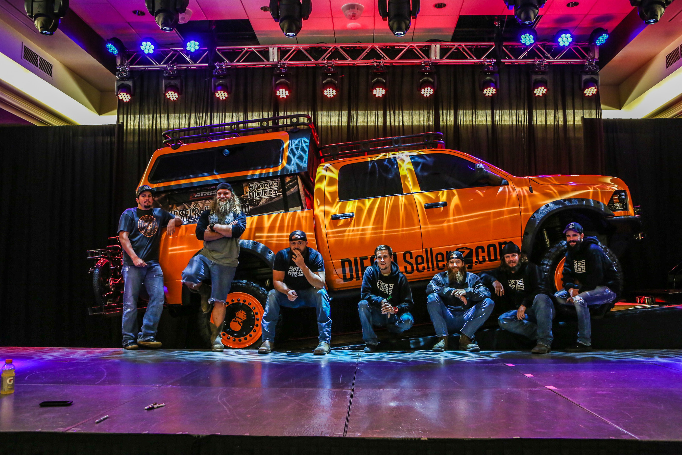 Diesel Brothers team in front of diesel truck custom built for Seven Feathers Casino Resort in Canyonville, OR. Pictured from left to right Chet "Shop Goon", Diesel Dave, Heavy D, Hans, Red Beard, Tyson "Shop Viking, D.J. "Thinmint".