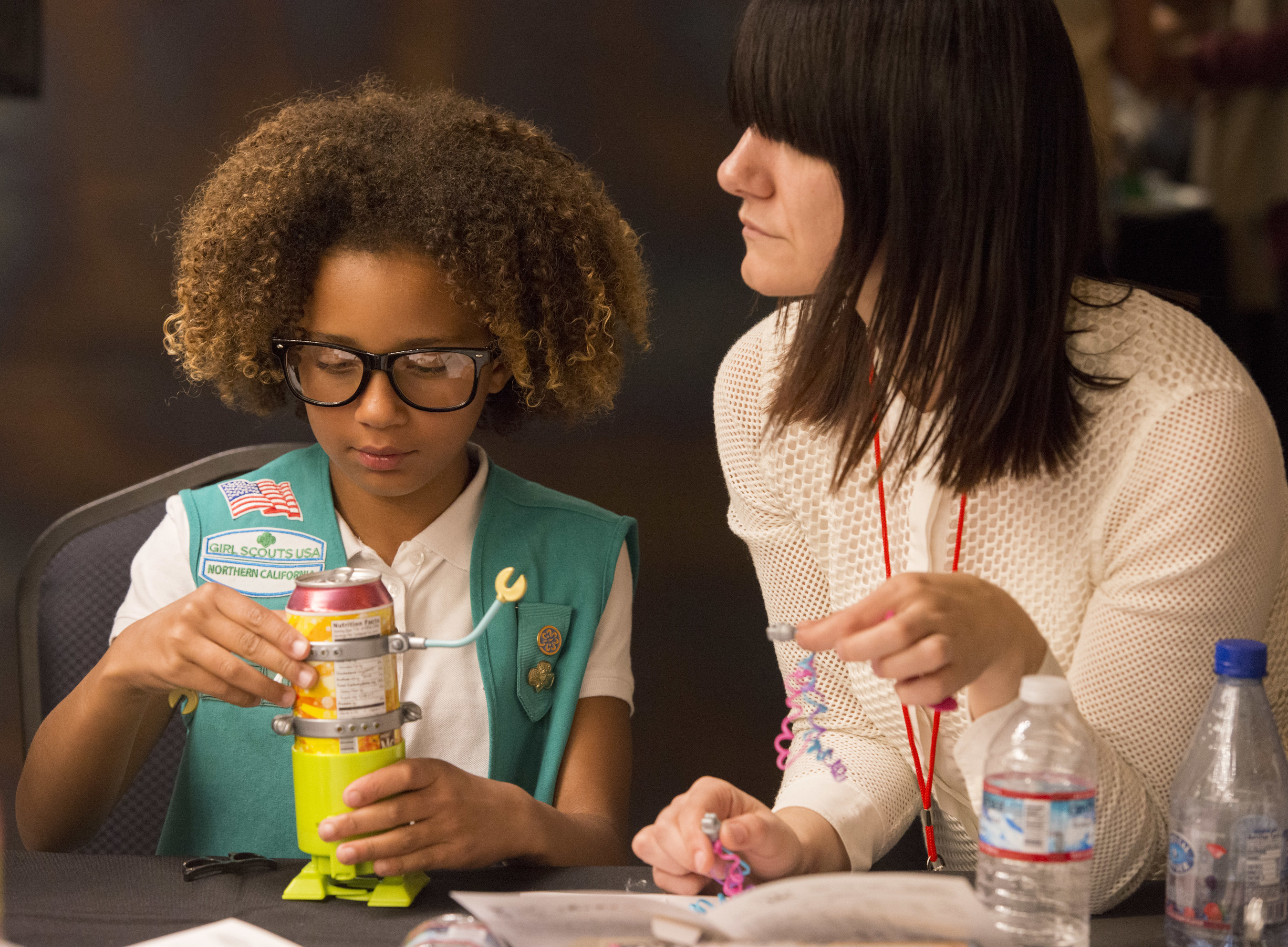 A Girl Scout builds a soda can robot with help from a female tech executive at the "She Rules: STEM" event at Netflix headquarters in Los Gatos, Calif., Tuesday, Oct. 4, 2016. Girl Scout troops representing Girl Scouts of Northern California met with real-world STEM experts to encourage the pursuit of STEM career paths for young girls.