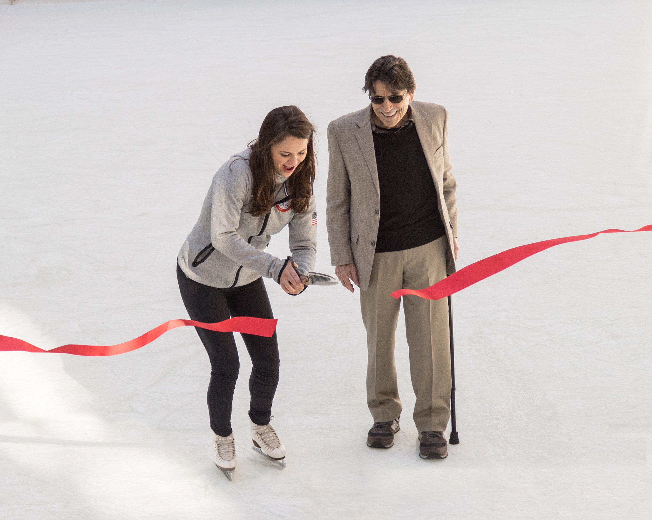Olympic Figure Skater Sasha Cohen cuts the ribbon to open The Rink at Rockefeller Center with famed ballet choreographer Edward Villella, October 11, 2016. Both participated in the  opening ceremony of The Rink, a world famous attraction that is celebrating its 80th anniversary season.