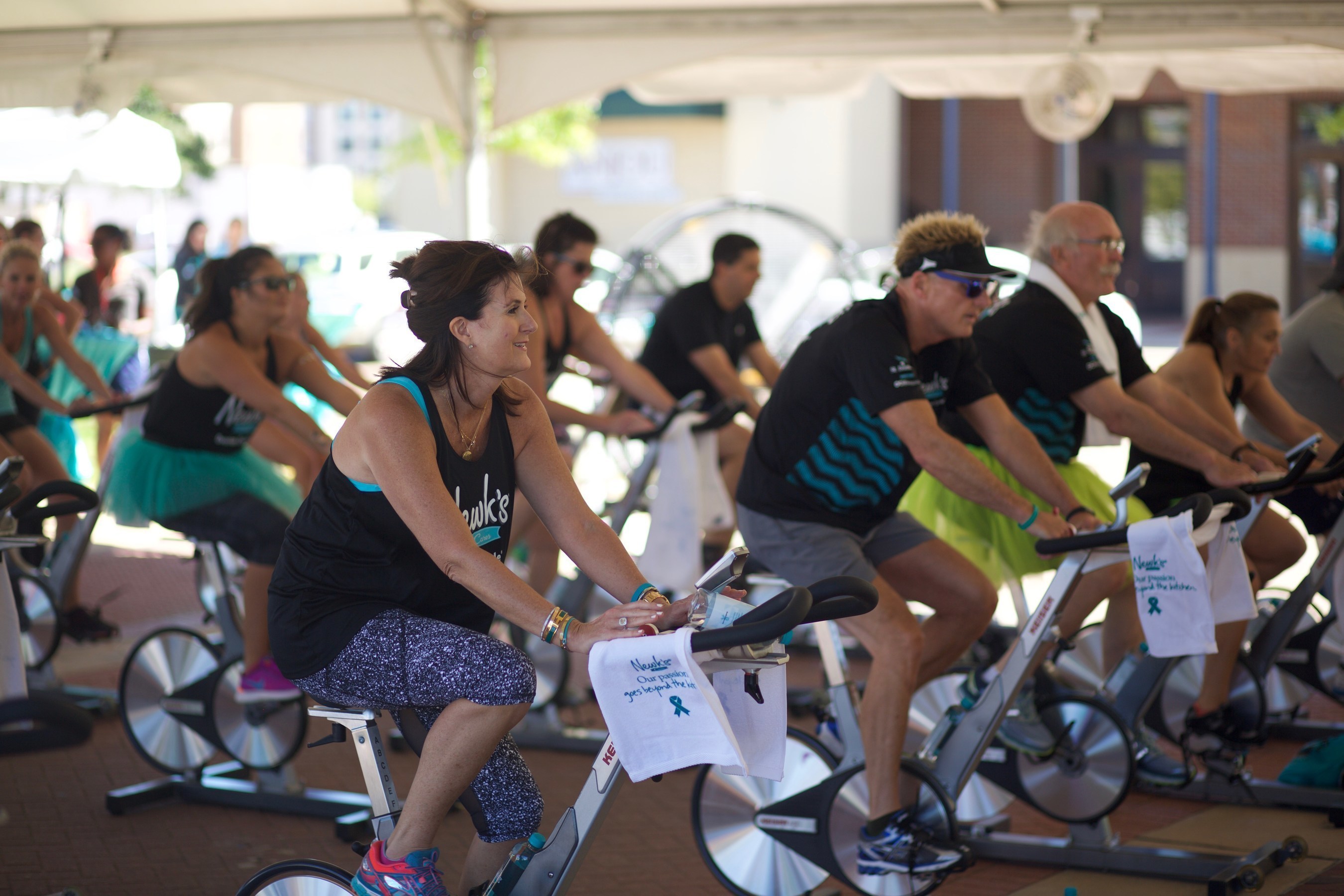 Newk's Cares Co-Founder Lori Newcomb joins riders in pedaling toward a cure at the third annual Ovarian Cycle(R) Jackson spin celebration.