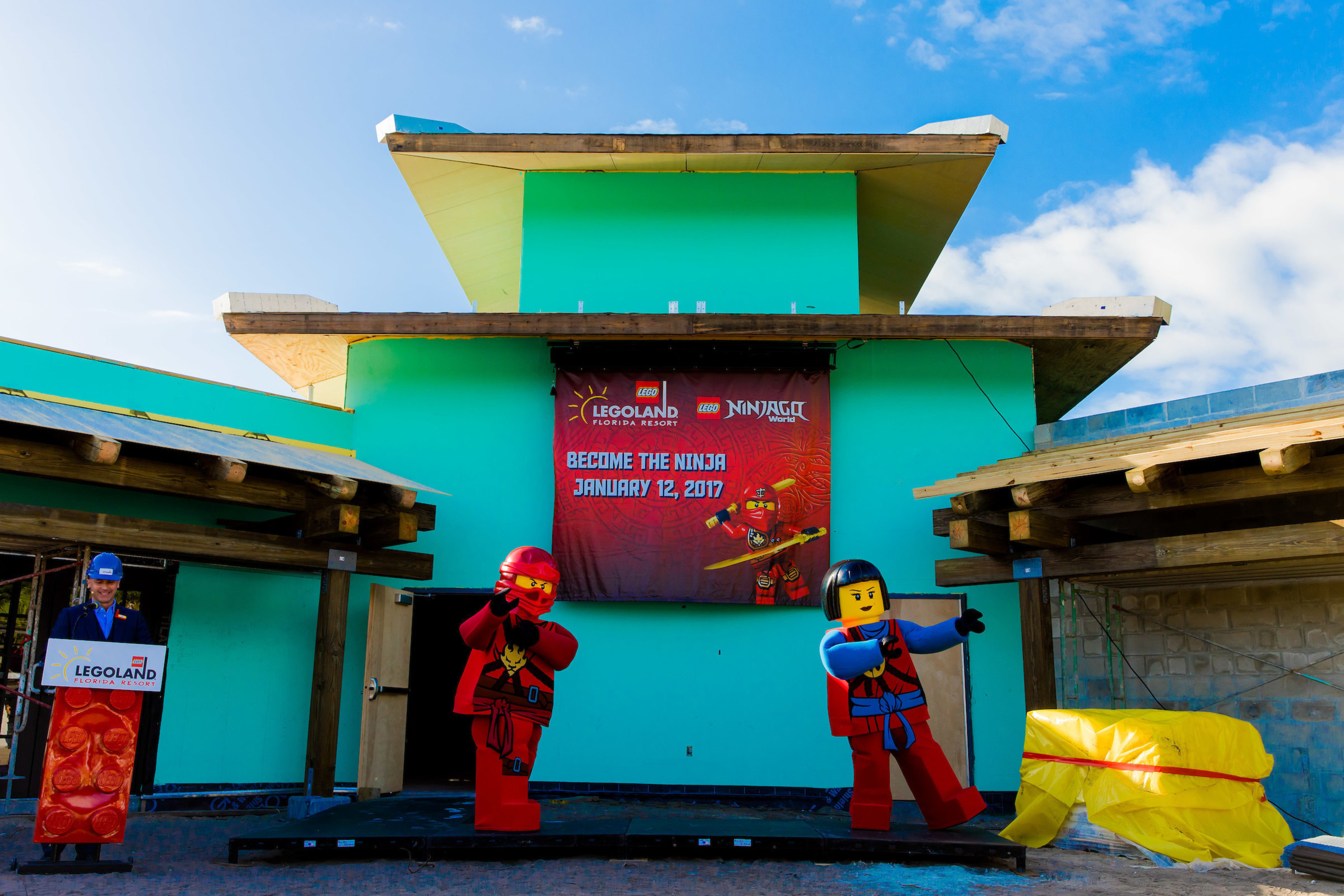 Brother-and-sister ninjas Kai, left, and Nya, helped reveal the grand opening date for LEGO NINJAGO World with Adrian Jones, general manager of LEGOLAND Florida Resort in Winter Haven, Fla.
