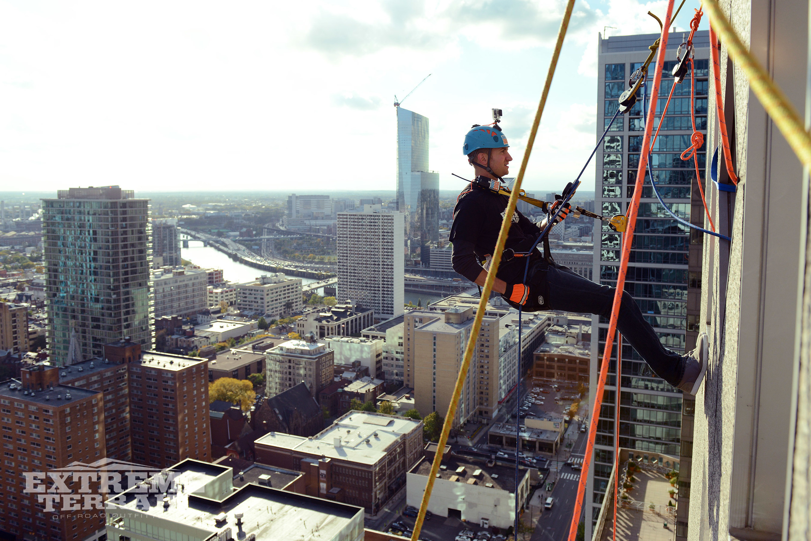ExtremeTerrain Co-founder Andrew Voudouris shows fellow adventurers how it's done as he gets ready to rappel over 500 feet to the Philly streets.