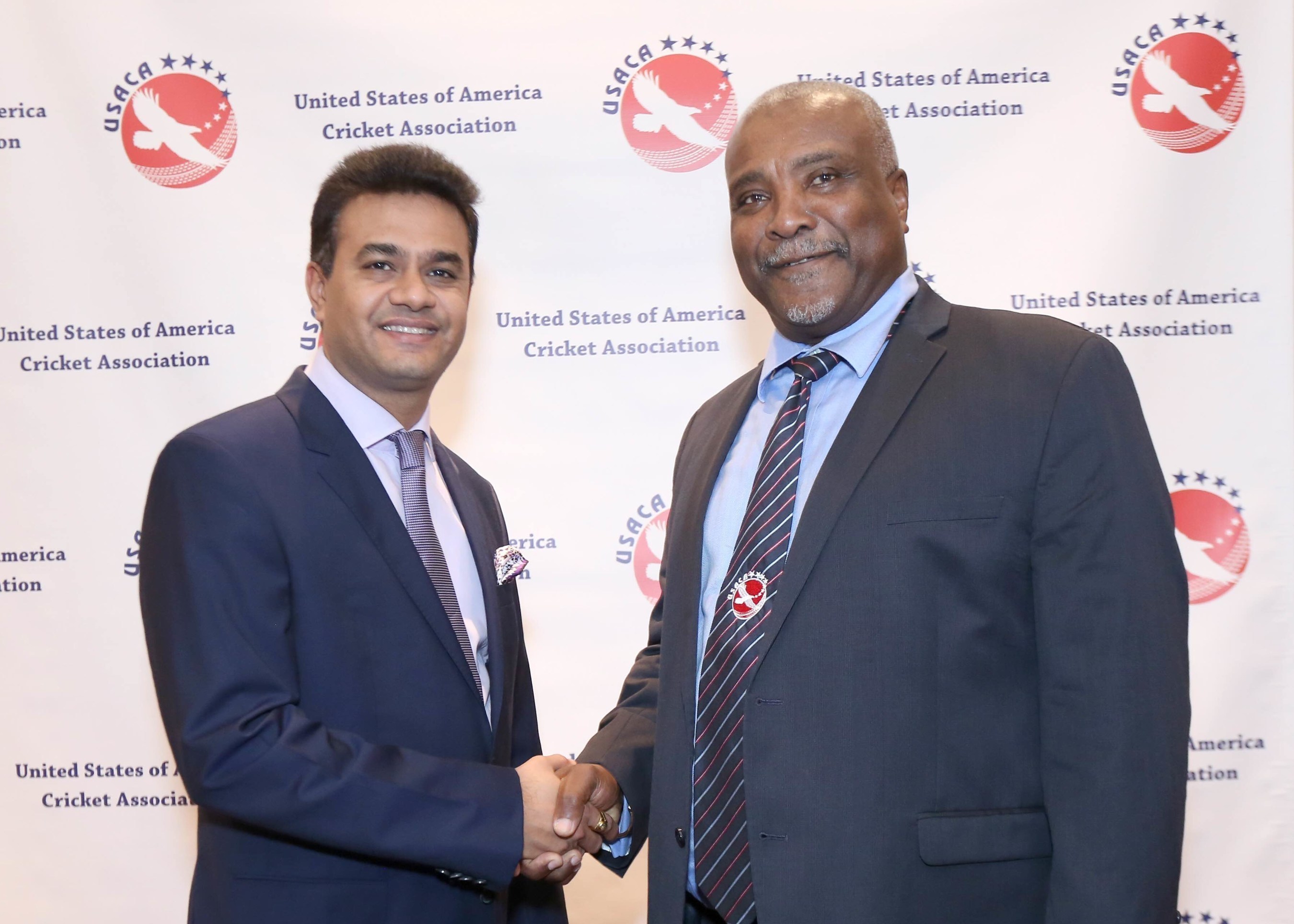 Global Sports Ventures Chairman, Jay Pandya and USACA President Gladstone Dainty shake hands during a press conference at the Marriott Marquis in New York City.