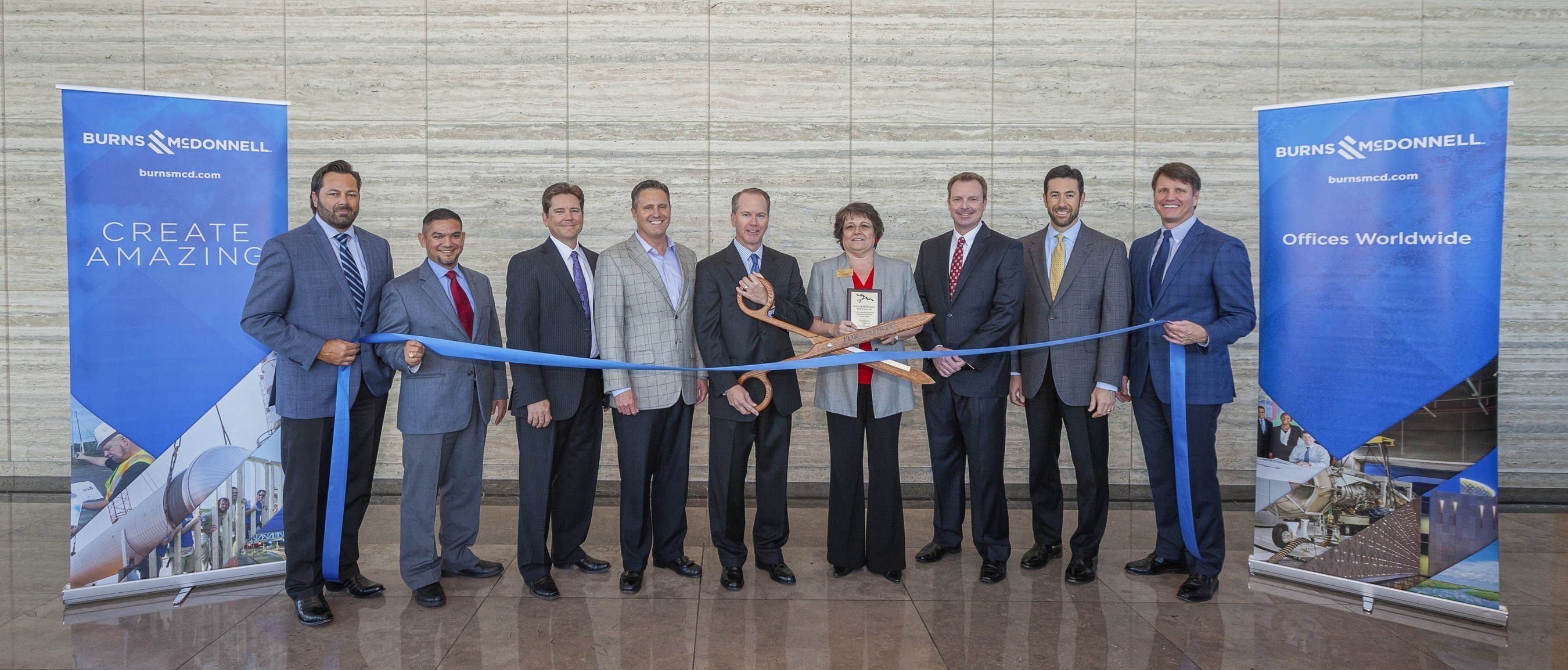 Burns & McDonnell celebrates the opening of its newest office in Fort Worth with a ribbon cutting with the Fort Worth Chamber of Commerce. Pictured left to right: Rod D'Spain, Gus Rodriguez, Chris Williams, Paul Fischer, Scott Clark, Pepper Sims, Kyle Lambert, John Schwartz and Tony Kimmey.