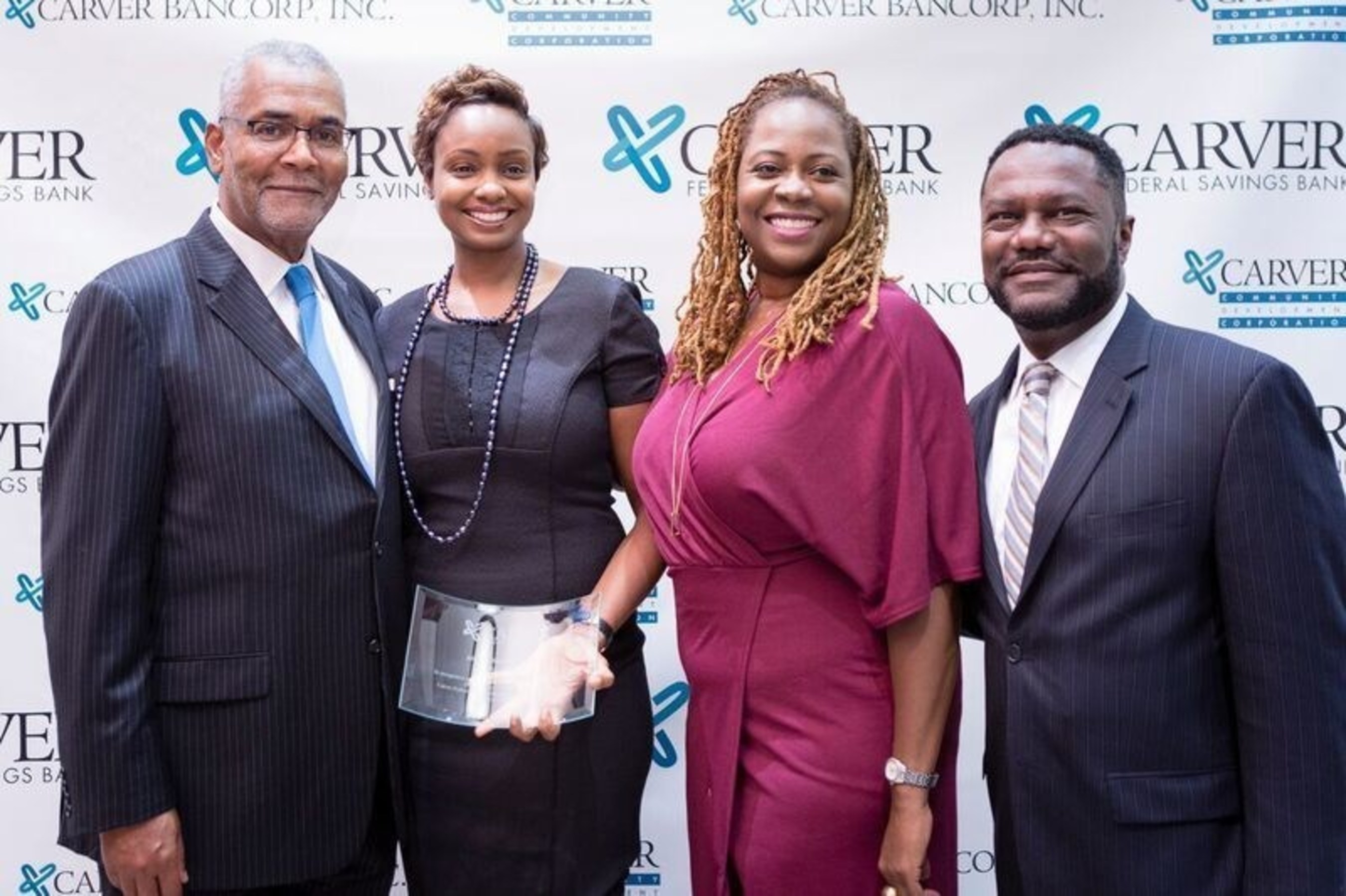 From left to right: Kenneth Knuckles, Carver Board of Directors, and President & CEO, Upper Manhattan Empowerment Zone, Aliyyah Baylor, Make My Cake; Blondel Pinnock SVP, Chief Lending Officer, Carver Federal Savings Bank; Michael T. Pugh, President & CEO, Carver Federal Savings Bank
