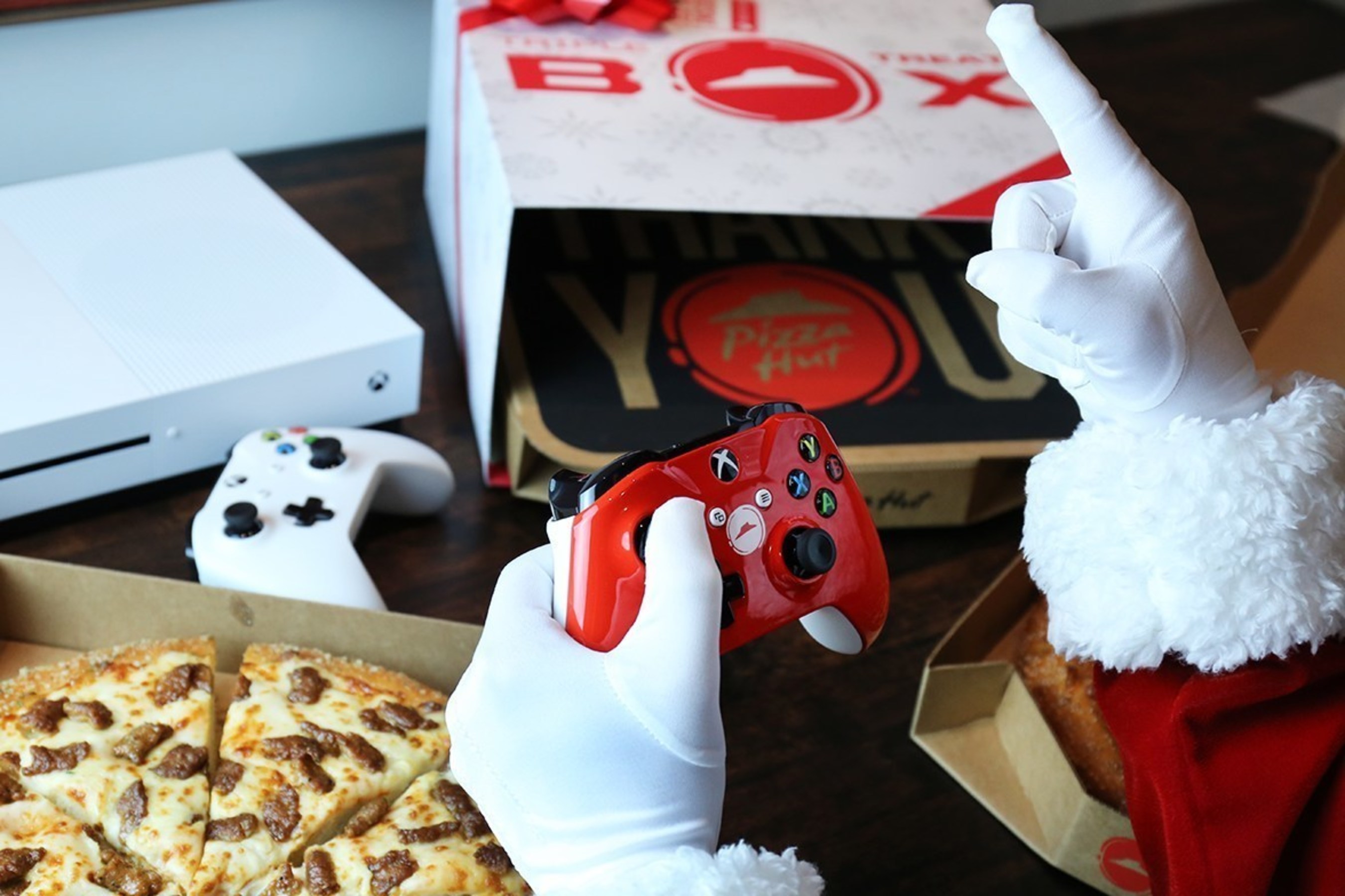 Pizza Hut and Xbox have teamed up to spread holiday cheer by adding a new treat to the Pizza Hut Triple Treat Box - the chance to win an Xbox One S, the ultimate games and 4k entertainment system every hour from Nov. 7 through Dec. 24. That's 1,140 free Xbox One S consoles. Customers will receive an entry code for a chance to win an Xbox One S and custom Pizza Hut designed red controller, as well as an offer for $10 off an Xbox One game with each purchase of a Triple Treat Box while supplies last.