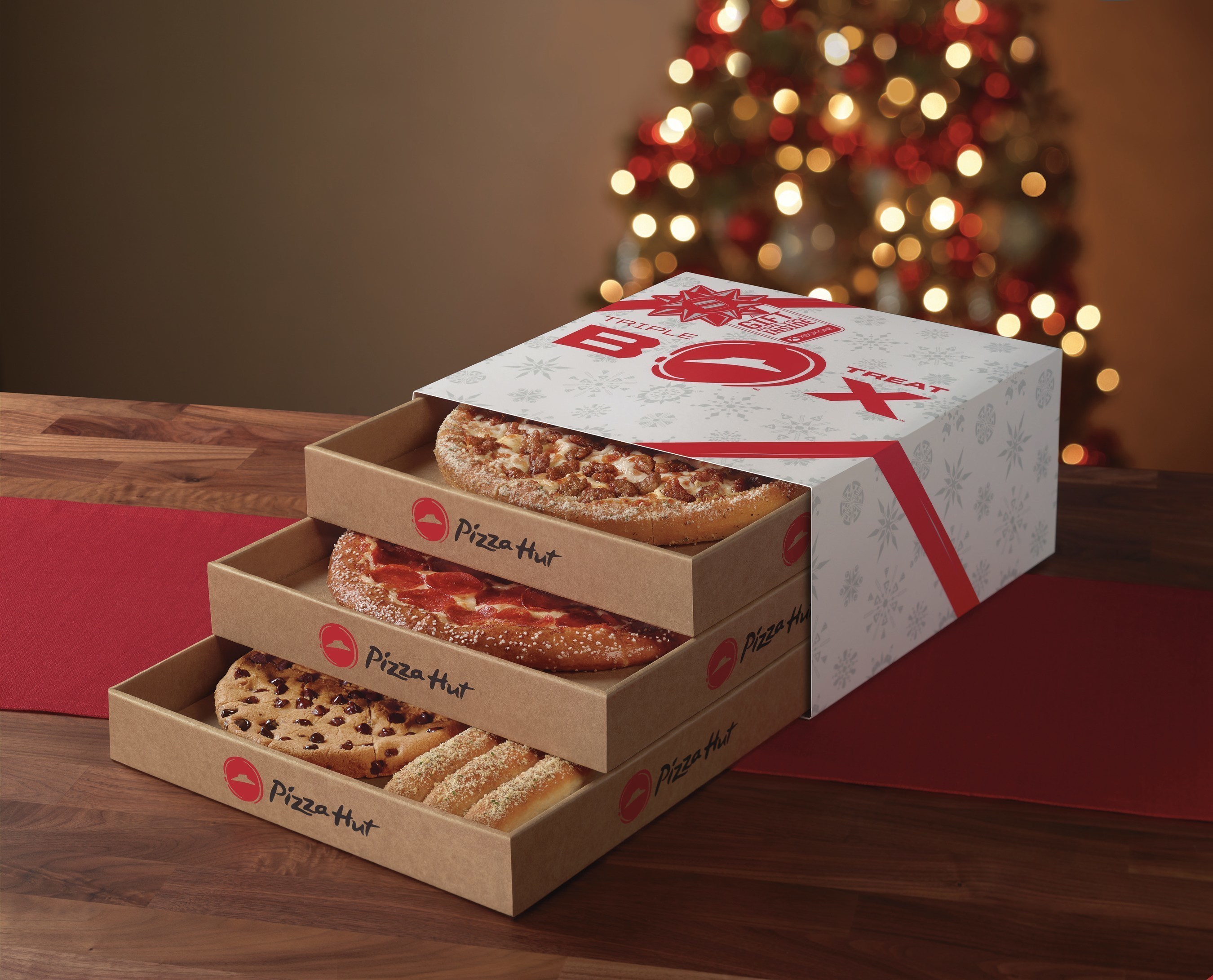 Perfect for get-togethers with friends and families looking to extend the fun of the holidays, the tri-level, holiday-themed Triple Treat Box from Pizza Hut will be available starting Nov. 7 for just $19.99 and includes two medium one-topping pizzas (available on Hand Tossed, Thin N' Crispy(R) or Pan), an order of breadsticks, a Hershey's Ultimate Chocolate Chip Cookie and a chance to win holiday fun for the whole family with an Xbox One S and custom Pizza Hut red controller.