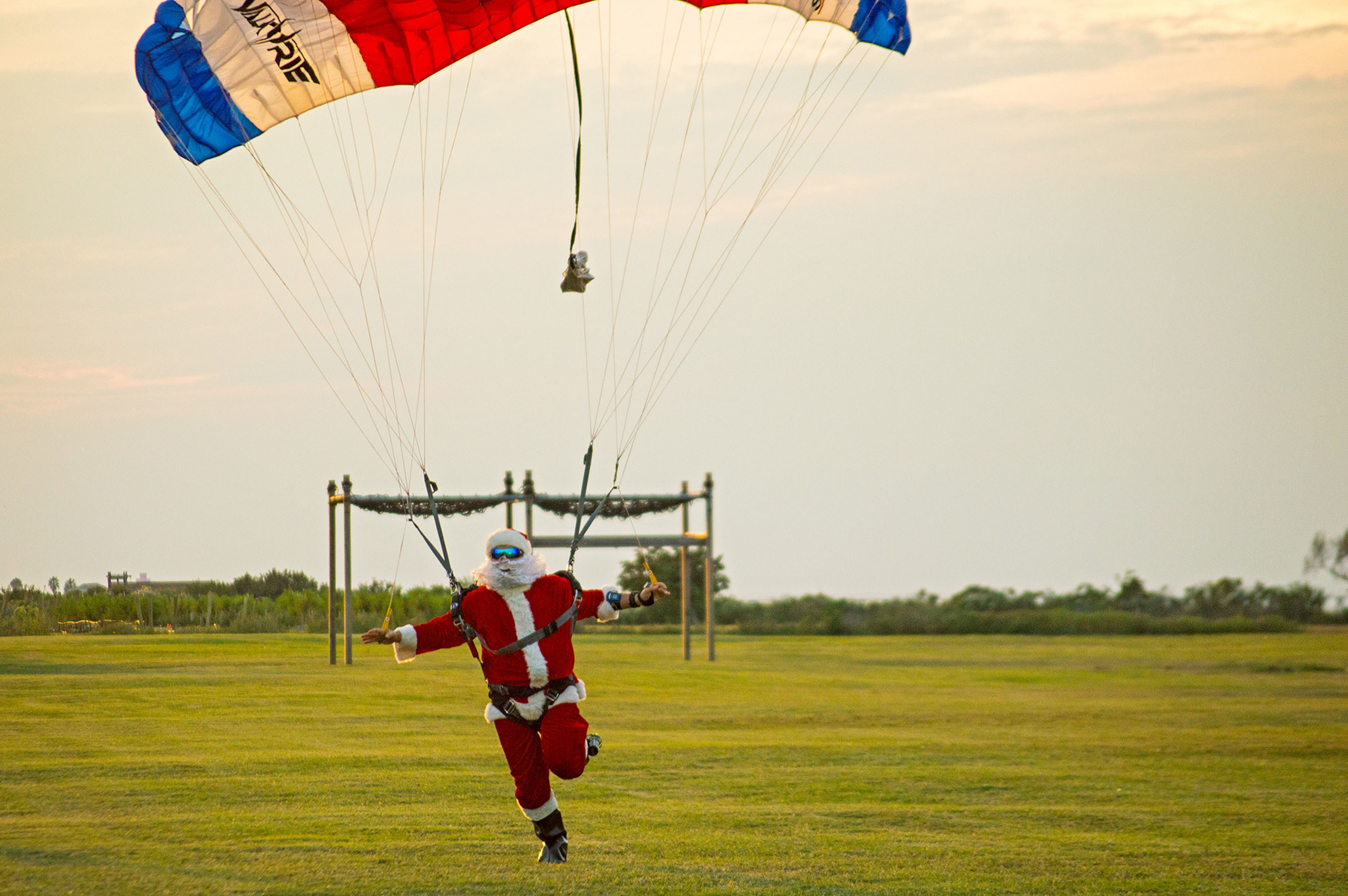 Santa parachuted in to a large crowd at Moody Gardens for the Opening Ceremony of Festival of Lights in Galveston, TX.