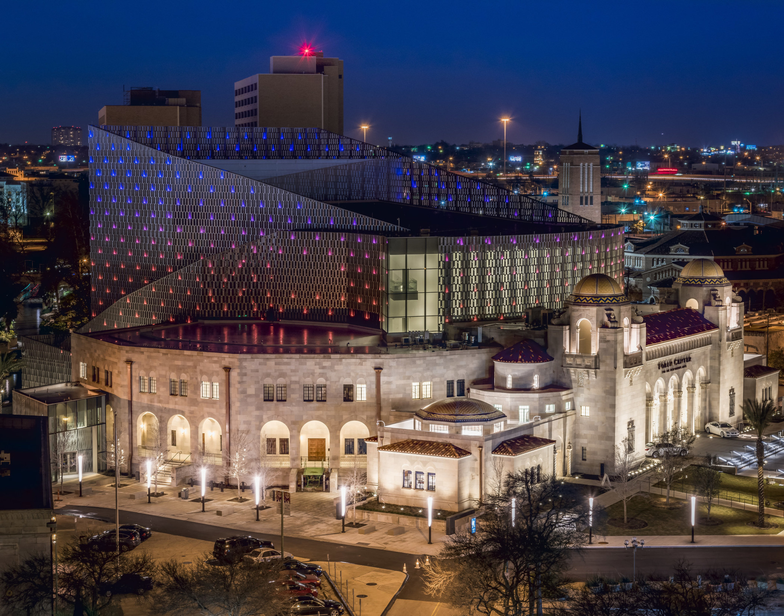 Tobin Center for the Performing Arts. The Tobin Center creates a vibrant connection with its urban context, from the formal entrance of the historic Municipal Auditorium to activating the River Walk Plaza. Image by Andy Crawford.