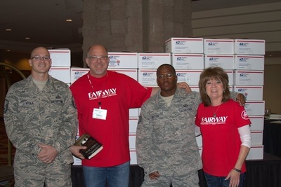 Fairway Independent Mortgage Corporation CEO Steve Jacobson with Louise Thaxton, director of Fairway's Military Mortgage Division pictured with two unidentified DM AFB Airmen