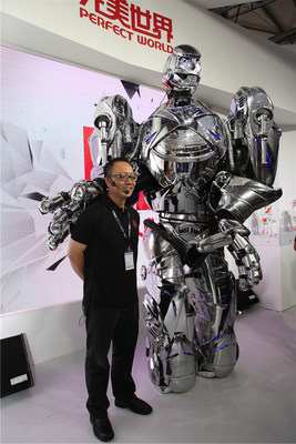 CEO Xiao Hong takes a photo with the robot while attending the opening ceremony of 2014 ChinaJoy