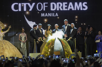 Melco Crown Entertainment's Co-Chairman and CEO Mr. Lawrence Ho and Mrs. Sharen Ho with Co-Chairman Mr. James Packer, were joined by Mr. Cristino Naguiat Jr, Chairman and CEO of PAGCOR and Mr. Henry Sy Jr, Chairman of SM Prime Holdings, to turn ceremonial keys to open the 'Fortune Egg' of City of Dreams Manila and cascade a 'Dream Cloud' of mechanical butterflies, officially marking the launch of the integrated resort.