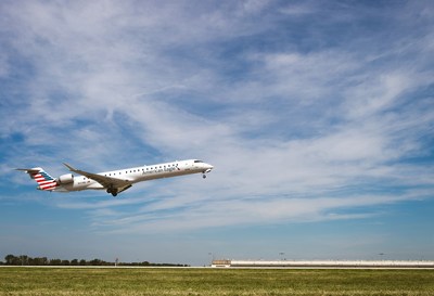 A CRJ-900 NextGen aircraft operated by PSA Airlines takes off from Dayton International Airport (DAY).