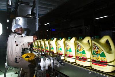 A Bidco Africa employee checks cooking oil samples as part of quality control at the manufacturing plant outside Nairobi, Kenya. An IT infrastructure and managed services deal with IBM will help Bidco improve its business application performance by 40 percent, lower capital expenditure and improve return on investment by 20 percent. Photo Credit: Bidco Africa Ltd