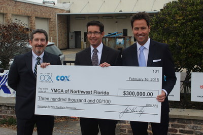 Dan Henson, regional vice president of operations for Cox Communications (center) presents a check to Jon Kagan, board chair for the YMCA of Northwest Florida (left), accompanied by Ashton Hayward, mayor of Pensacola (right).
