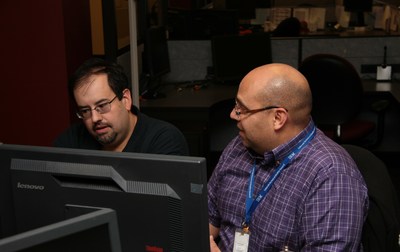 Members of IBM's Managed Storage Services team discuss security requirements for a client's backup and restore virtual environment in IBM's Global Delivery Center in Boulder, Colorado. Forrester Research named IBM the leading supplier in global infrastructure outsourcing, based on a survey of 13 top firms, saying IBM "leads the pack" by a substantial margin. (Photo credit: IBM)