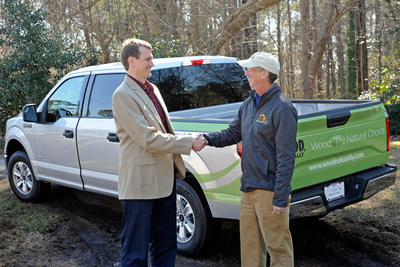Will Telligman of the Southeastern Lumber Manufacturers Association hands over the keys to a new 2015 Ford F150 to Wood, Naturally Build and Design Sweepstakes winner Joel Harper, owner of Atlanta-based Leisure Time Decks.(Photo Credit: Jason Braverman)