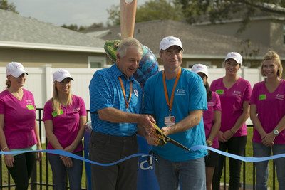 For the second year since its sponsorship of the Valspar Championship, Valspar again joined forces with Habitat for Humanity and the PGA TOUR Wives Association. This year, a new neighborhood park, "Chameleon Commons," named in honor of the colorful Valspar mascot, was officially unveiled in the Stevens Creek community of Habitat homes in Clearwater, Florida. Larry Morgan, left, Chair of the Copperhead Charities, and Les Ireland (right) Valspar Executive Vice President and President, Global Consumer Paint cut the dedication ribbon to officially open the park. The park is a gift made possible by proceeds from the 2014 Valspar Championship.