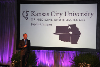 Dr. Marc B. Hahn announces new campus in Joplin, Missouri for the Kansas City University of Medicine and Biosciences during his presidential investiture March 26, 2015.