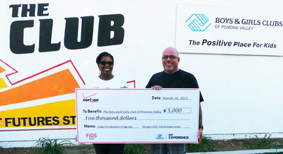 Verizon FiOS of Southern California Senior Marketing Events Manager, Collette Combre, presents the Executive Director of the Boys & Girls Club of Pomona Valley, Victor Caceres, with $5,000 in grants and technology donations to upgrade the club's tech room and video production program.