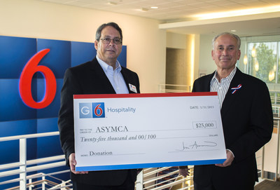 Jim Amorosia (left), CEO G6 Hospitality, presents donation to Tony Mino (right), Executive Director Armed Services YMCA in Killeen, Texas