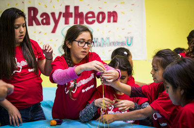 A team works on a science project during a recent event at a Los Angeles-area Boys & Girls Club. Raytheon and Boys & Girls Clubs of America are partnering to build 'Centers of Innovation' that will offer military youth a place to use and develop their science and math skills.