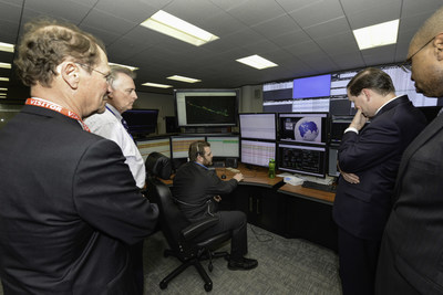 DOE representatives look into the brain of the intelligent grid at CenterPoint Energy's technology center.