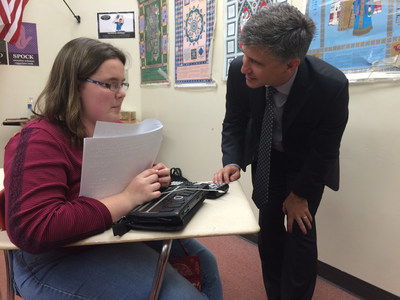 Peter Balyta, Ph.D., president of TI Education Technology, observes Lillie Pennington, 17, using the world's first talking graphing calculator, an innovation of Texas Instruments, Orbit Research and the American Printing House for the Blind.