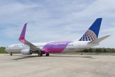 United's March of Dimes commemorative aircraft parked on runway.