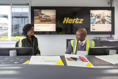 On her work placement at Hertz, Kingston College Travel & Tourism Level 3 student Davida Arhin learns about Hertz Gold from Customer Service Representative Abel Kahuni. Hertz and Kingston College connected through the Global Travel and Tourism Partnership.