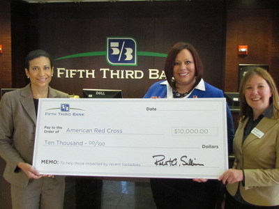 Fifth Third Bank (Chicago) Senior Vice President of Community Development, Nicole Johnson-Scales (pictured, left) presents $10,000 check to the American Red Cross of Chicago, to assist tornado victims across Northern Illinois. Accepting the check on behalf of the American Red Cross are Susan Westerfield, Major Gofts Officer (pictured, center), and Patricia Kemp, Communications Manager (pictured, right).