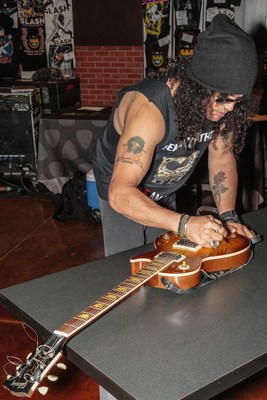On May 19th, 2015, Grammy award winning artist SLASH signs the Gibson Les Paul '58 Reissue guitar on display at Hard Rock Hotel & Casino Sioux City. PHOTO CREDIT: Matt Downing.