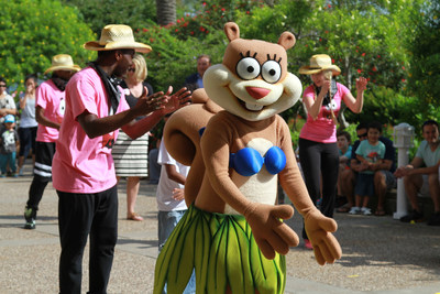 Nickelodeon character Sandy Cheeks shows her dance moves with the Sweft Washington Dance Troupe at Moody Gardens grand opening of SpongeBob SubPants Adventure May 23