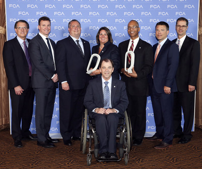 The Johnson Controls team accepted two 2014 FCA US Qualitas Awards for the company's diversity and cost reduction efforts.