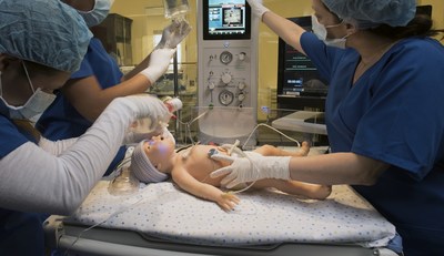 A team of health care professionals practice stabilizing a newborn with Gaumard's newest life-like simulator, Newborn Tory(TM) S2210.
