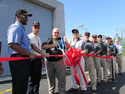 Plant Vogtle 1 and 2 Vice President Keith Taber cuts the ribbon to dedicate the site's new FLEX Dome storage building.
