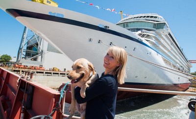 Viking Sea's godmother, Karine Hagen, and her traveling yellow Labrador, Finse, during the ship's float out ceremony on June 25. The traditional ceremony took place yesterday, June 25, at Fincantieri's Ancona shipyard.