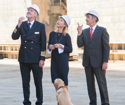 Karine Hagen, Viking's senior vice president of product and godmother to Viking Sea, and Capt. Gulleik Svalastog, receiving a tour from Fincantieri director Giovanni Stecconi.
