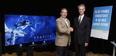 Value Electronics Owner Robert Zohn (right) presents the 2015 TV Shootout(TM) award for the LG Art Slim CURVED OLED 4K TV (Model 65EG9600) to Tim Alessi, director of new product development for home entertainment at LG Electronics USA (left).