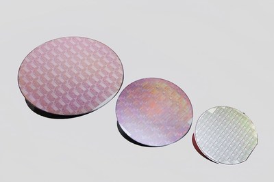 Peregrine Semiconductor's UltraCMOS(R) technology platform now includes 300 mm wafers. Pictured are wafers from the UltraCMOS 11 technology platform (left), UltraCMOS 10 platform and UltraCMOS silicon on sapphire (right).