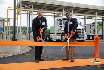Direct Energy Business President John Schultz (left) and John Nahill, CEO of XNG, cut the ribbon at the new Manheim CNG Center in upstate New York. Direct Energy and XNG partnered to bring this first-of-its-kind facility to the area.