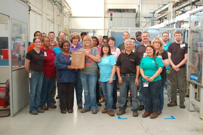 Employees from BorgWarner's manufacturing facility in Seneca, South Carolina, proudly display their latest Excellence in Quality Award from Honda North America. Since 2002, the plant has earned 12 supplier awards from Honda, including seven awards for quality, four for delivery and one for engineering innovation.
