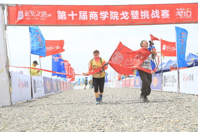 Johnson's Sun and Wang cross the finish line with pride.